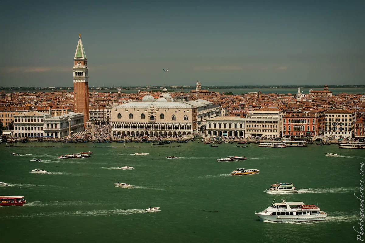 Venice from the water — the Campanile, the Doge's Palace, boats crossing in every direction. 