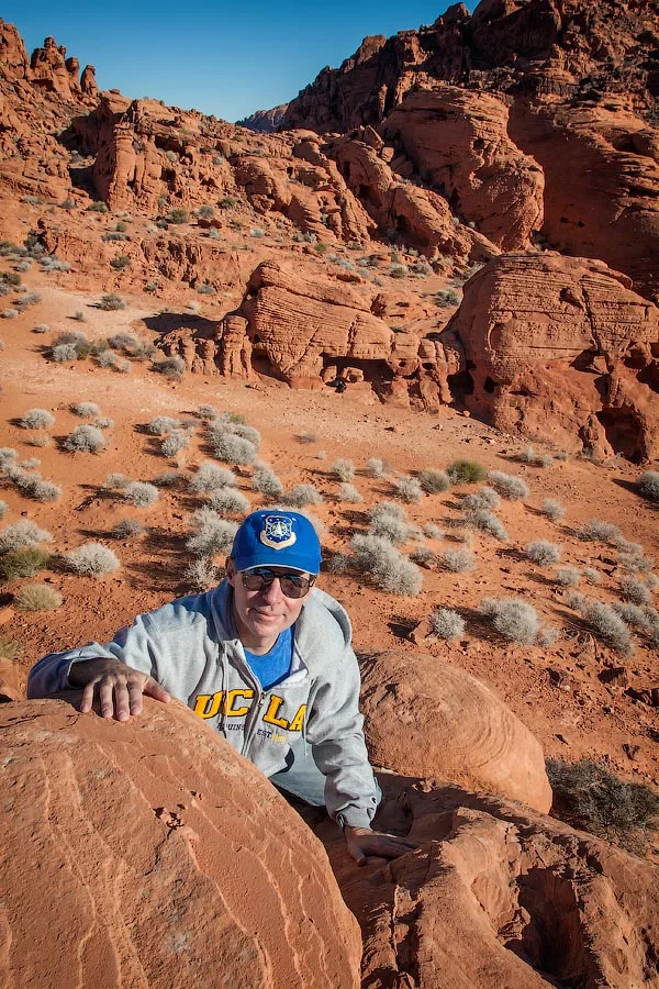Alex climbing a rock formation