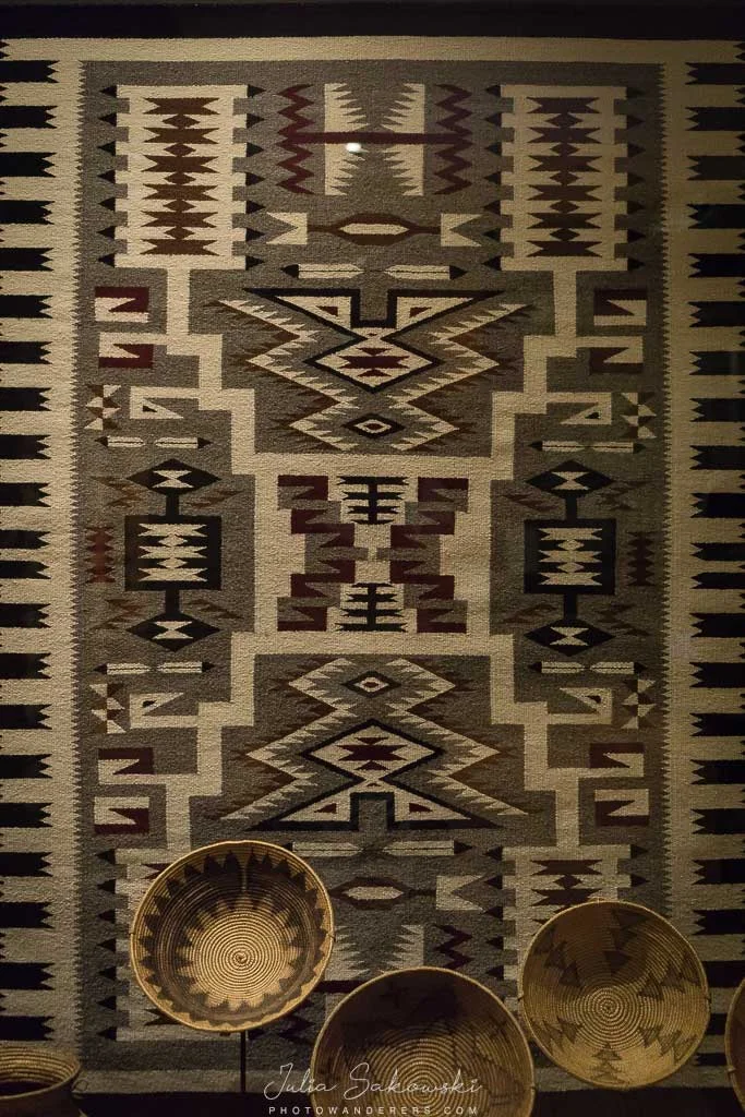 Navajo rug and baskets. The Spanish conquistadors were already trading for these blankets in the 16th century.