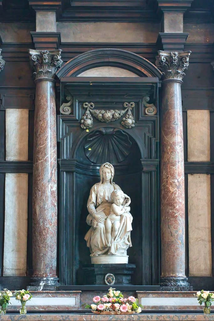The Madonna of Bruges — white marble in a dark niche, found at last in the right church.