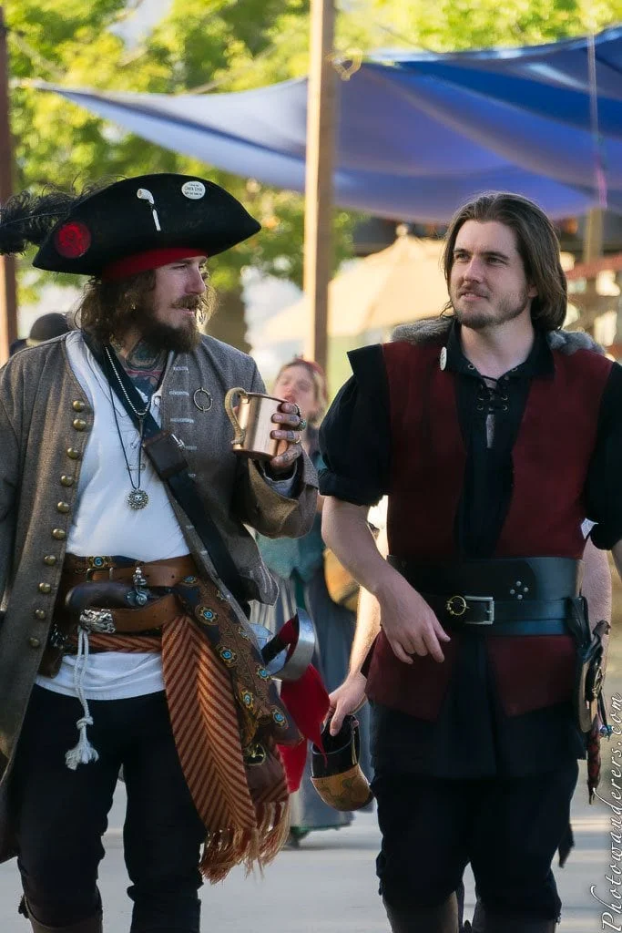 Two privateers on shore leave. Technically licensed by the Crown. Functionally: pirates.