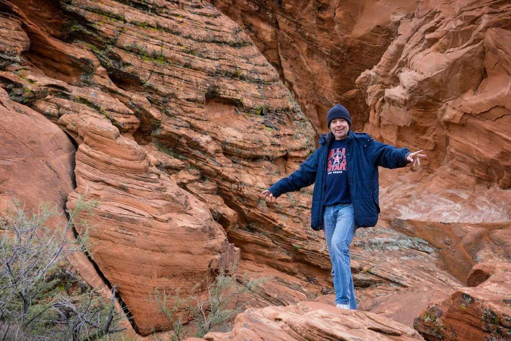 Alex standing at the base of Atlatl Rock