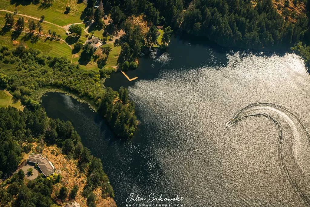 A speedboat writes its signature on the water. 